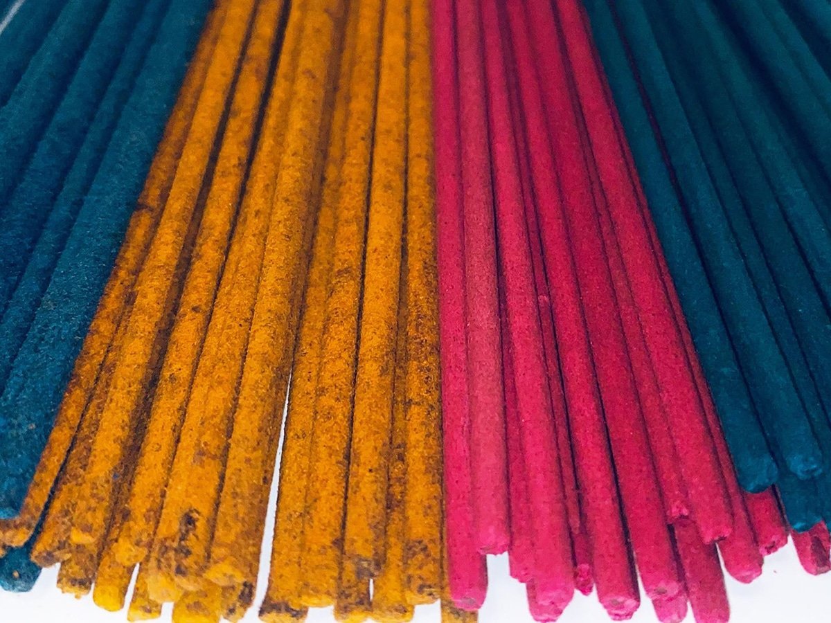 Burning Incense Sticks for Protection